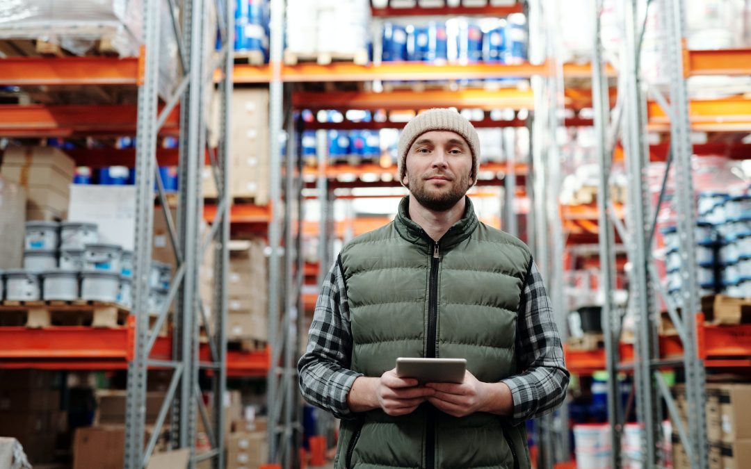 Man Standing in Warehouse